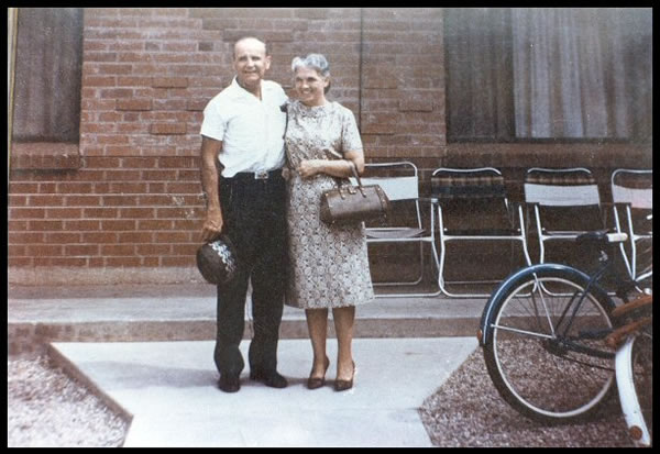 Brother Branham and Sister Meda Branham in front of the apartment Brother Branham and Sister Meda Branham in front of the apartment